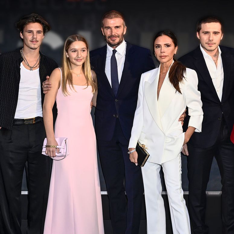 Image may contain: Victoria Beckham, David Beckham, Fashion, Adult, Person, Groupshot, Accessories, Bag, and Handbag